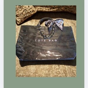 Black Tote Bag with Chain And Bow Accessories.